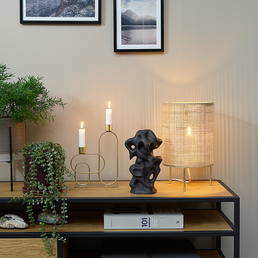 SVENN artificial plant in AXEL plant pot, ERVIN candlestick, STEN ornament and ALBERT table lamp Plant pots, artificial plants, candlestick, ornament and table lamp on top of a TV stand