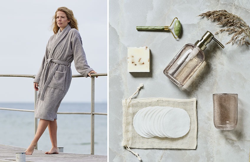 Woman in grey bathrobe and bathroom accessories 