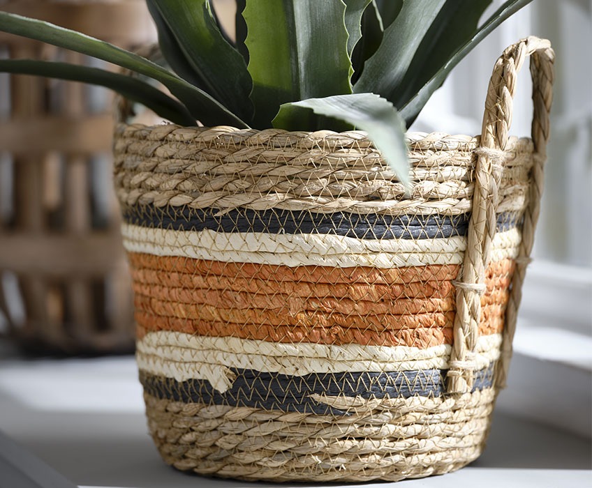 Wicker basket with orange, black and white details